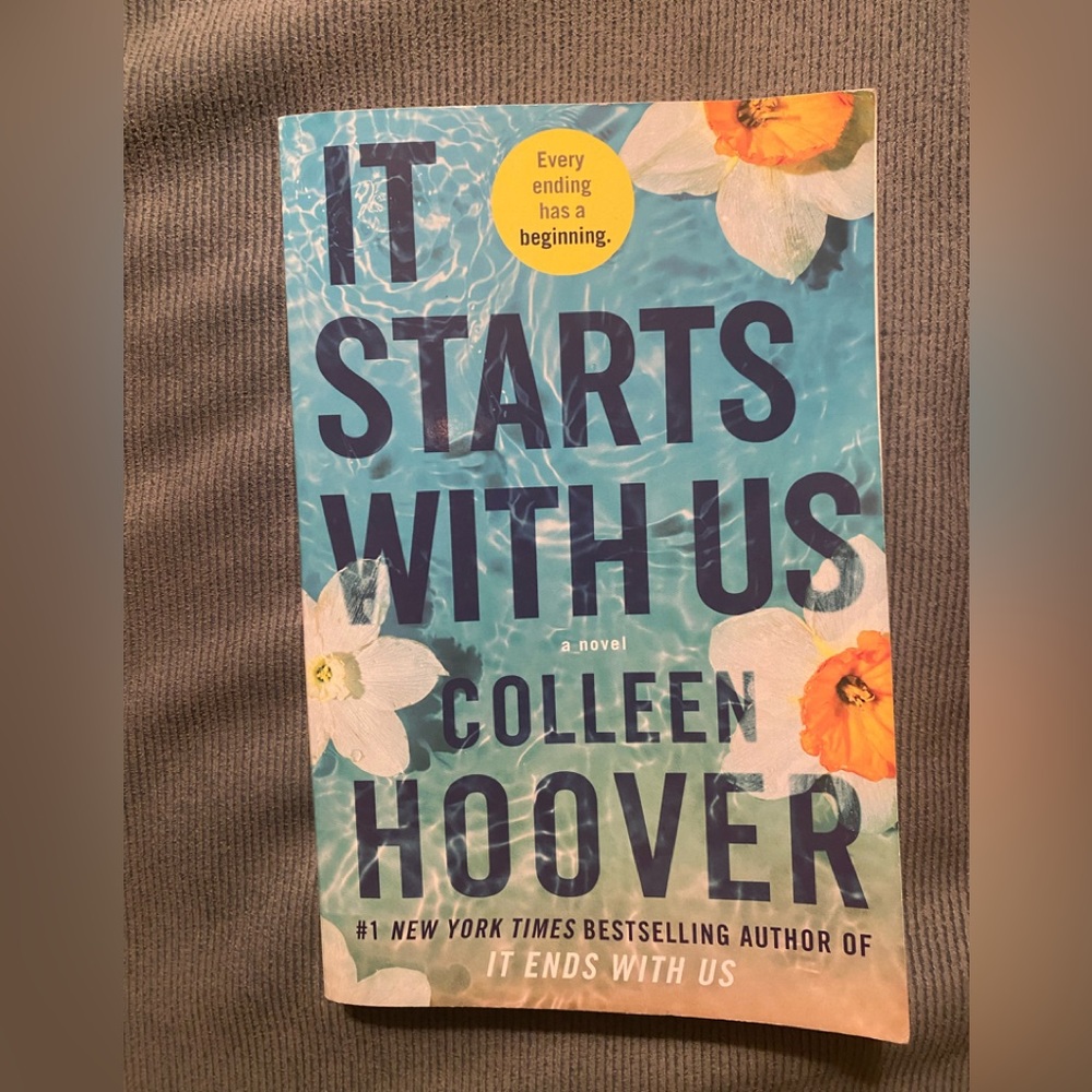 It Starts with Us paperback book by Colleen Hoover
